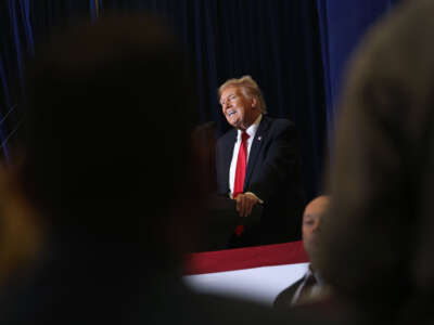 Former President Donald Trump speaks at a campaign event at the Hyatt Hotel on December 13, 2023, in Coralville, Iowa.