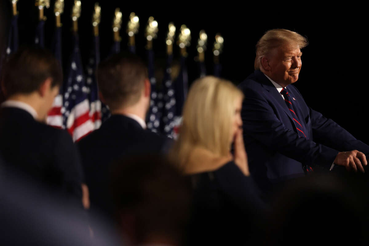 Then-President Donald Trump delivers his acceptance speech for the Republican presidential nomination as son-in-law and senior advisor Jared Kushner and children Eric and Ivanka Trump look on on the South Lawn of the White House August 27, 2020, in Washington, D.C.