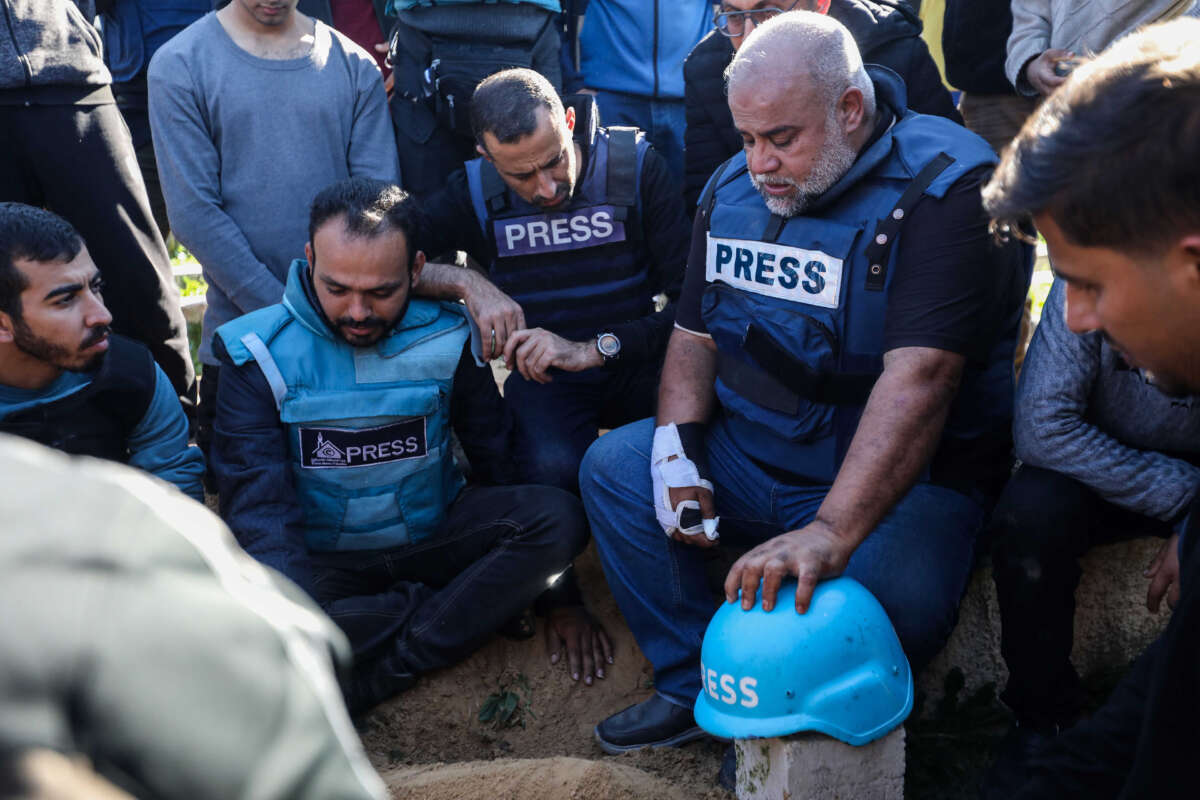 Family and friends, including Al Jazeera reporter, Wael Al-Dahdouh (2nd right), bid farewell to the bodies of journalists Hamza Al-Dahdouh and Mustafa Thuraya on January 7, 2024, in Rafah, Gaza. The journalists, Hamza Al-Dahdouh and Mustafa Thuraya, were reportedly killed when their car was bombed after reporting from an air strike on a building that morning.