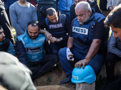 Family and friends, including Al Jazeera reporter, Wael Al-Dahdouh (2nd right), bid farewell to the bodies of journalists Hamza Al-Dahdouh and Mustafa Thuraya on January 7, 2024, in Rafah, Gaza. The journalists, Hamza Al-Dahdouh and Mustafa Thuraya, were reportedly killed when their car was bombed after reporting from an air strike on a building that morning.