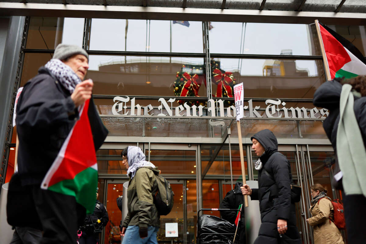 Pro-Palestinian protestors gather outside of the New York Times building to protest the newspaper’s coverage of the Israel-Hamas war on December 11, 2023, in New York City.