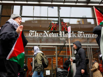 Pro-Palestinian protestors gather outside of the New York Times building to protest the newspaper’s coverage of the Israel-Hamas war on December 11, 2023, in New York City.