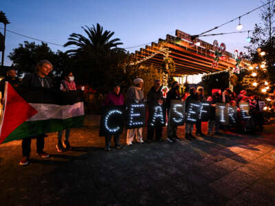 People gather at Noe Valley Town Square for a ceasefire vigil in solidarity of Palestine and protest Israeli attacks on Gaza, in San Francisco, California, on January 6, 2024.