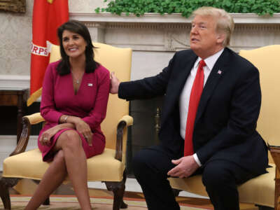 Then-President Donald Trump announces that he has accepted the resignation of Nikki Haley as U.S. Ambassador to the United Nations, in the Oval Office, on October 9, 2018, in Washington, D.C.