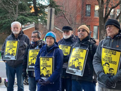 Activists rally outside the El Salvadorian embassy in Washington D.C. on January 11, one year after five Water Defenders who championed El Salvador's anti-mining law were arrested on charges dating back to the country's brutal civil war.