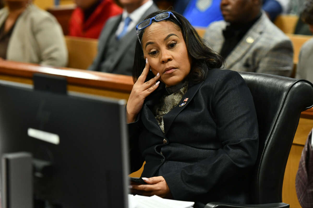 Fulton County District Attorney Fani Willis appears before Judge Scott McAfee for a hearing in the 2020 Georgia election interference case at the Fulton County Courthouse on November 21, 2023, in Atlanta, Georgia.