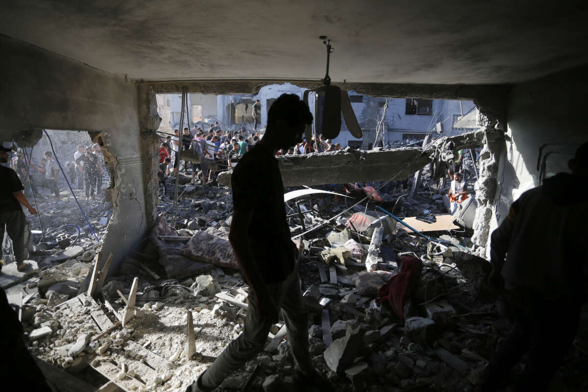 Civil defense teams and citizens continue search and rescue operations after an airstrike hit a building belonging to the Maslah family during the 32nd day of Israeli attacks in Deir Al-Balah, Gaza, on November 7, 2023.