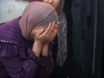 Palestinians mourn the death of loved ones following Israeli bombardment on January 18, 2024, in Rafah in the southern Gaza Strip.