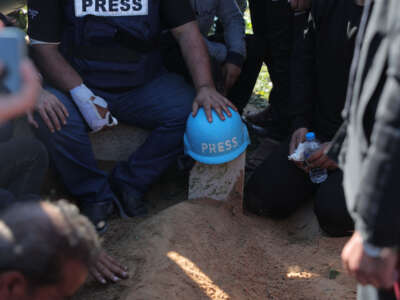 Families, loved ones and colleagues of two journalists who were killed, including Hamza Dahduh, the son of Al Jazeera correspondent Wael Dahduh, attend the funeral ceremony in Rafah, Gaza, on January 7, 2024.