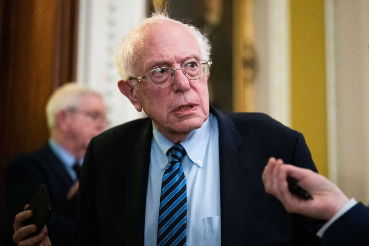 Sen. Bernie Sanders talks with reporters after the senate luncheons in the U.S. Capitol on November 28, 2023.