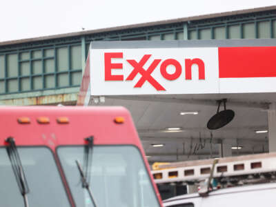 A truck is seen outside of an exxon mobil gas station