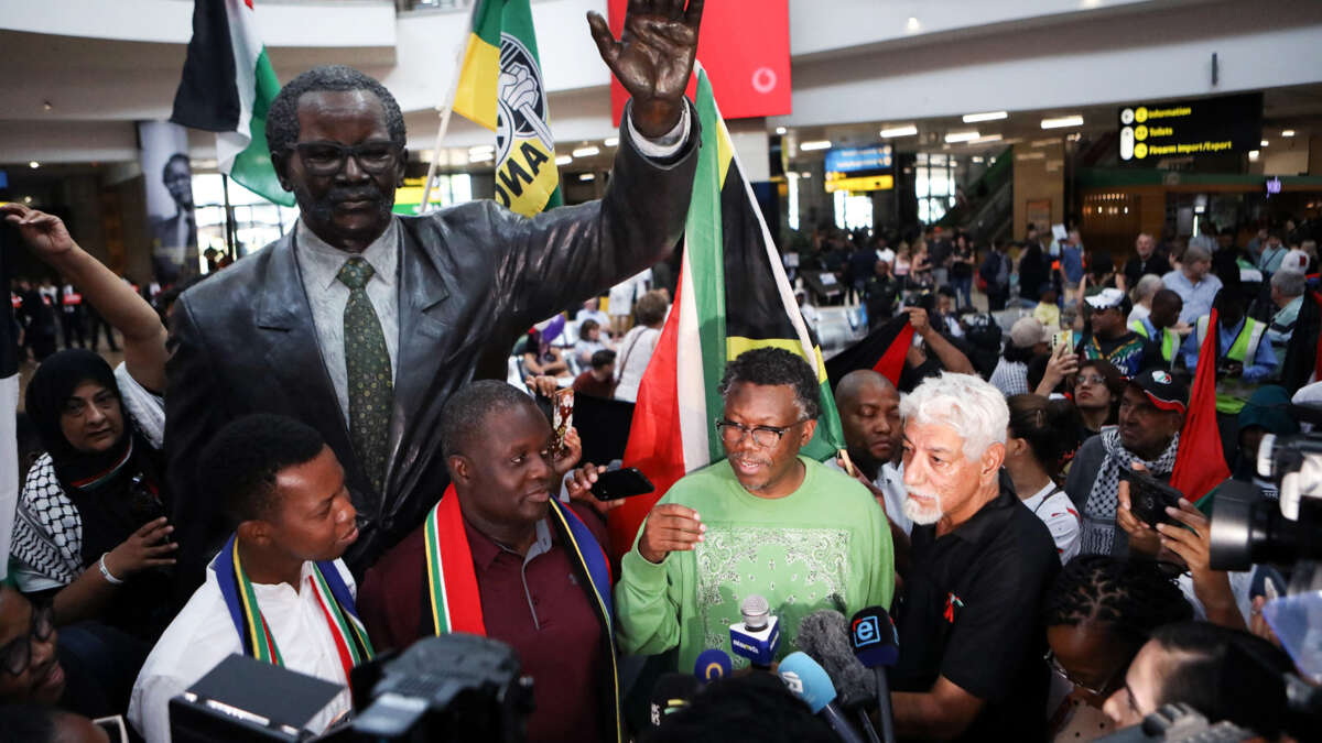 Members of the South African legal team speak to the press