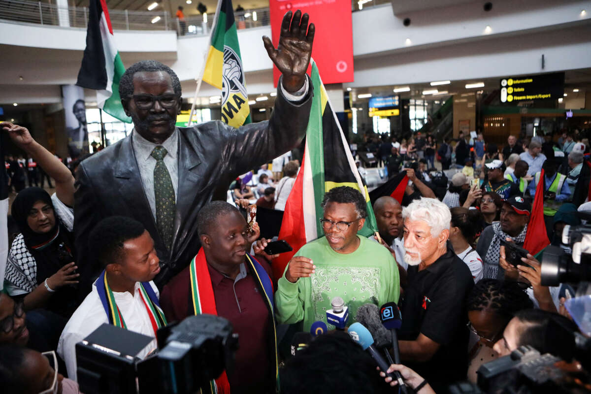 Members of the South African legal team speak to the press