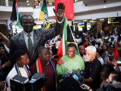 Members of the South African legal team speak to the press