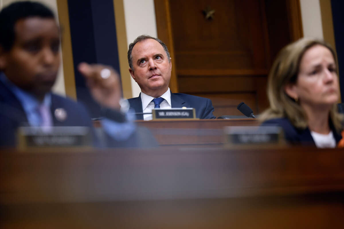 Rep. Adam Schiff looks up at the ceiling at something during a hearing