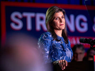 Nikki Hayley stands at a podium during a campaign event