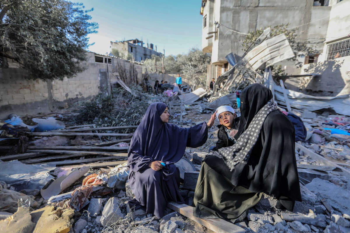 People inspect damage to their homes caused by Israeli air strikes, on January 18, 2024, in Rafah, Gaza.