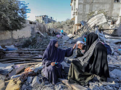 People inspect damage to their homes caused by Israeli air strikes, on January 18, 2024, in Rafah, Gaza.