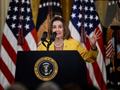 Nancy Pelosi speaks at a podium
