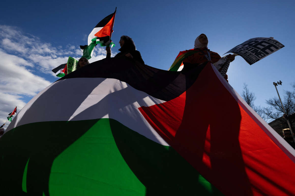 Participants in the March on Washington for Gaza rally displayed their support by waving Palestinian flags during the event in front of the White House in Washington, D.C., on January 13, 2024.