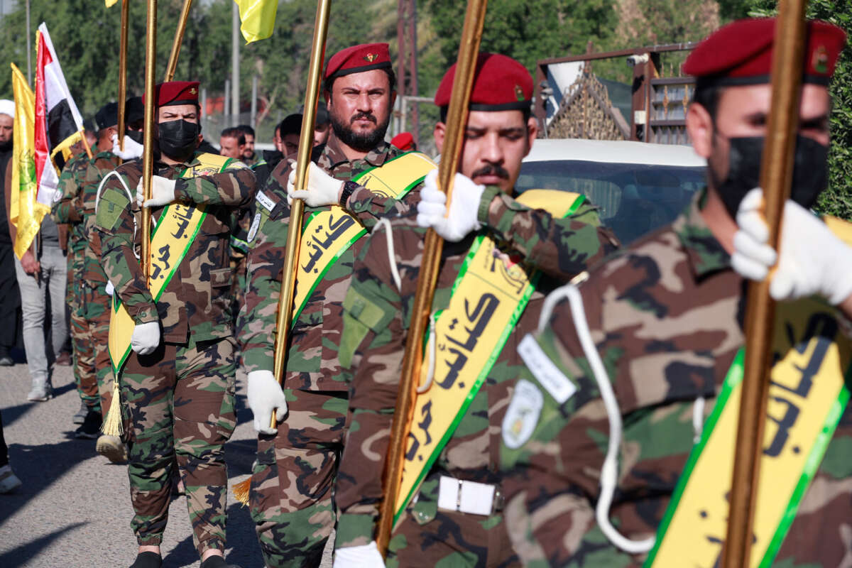 The al-Nujaba and Kataib Hezbollah march in formation