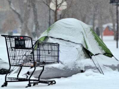 Tents in the snow at homeless encampment in Chicago