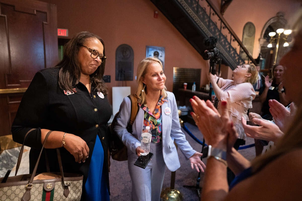 Democratic state Sen. Margie Bright Matthews (L) and Republican state Sen. Sandy Senn react to supporters after the Senate passed a ban on abortion after six weeks of pregnancy at the South Carolina Statehouse on May 23, 2023, in Columbia, South Carolina. A bi-partisan group of five women led a filibuster that failed to block the legislation.