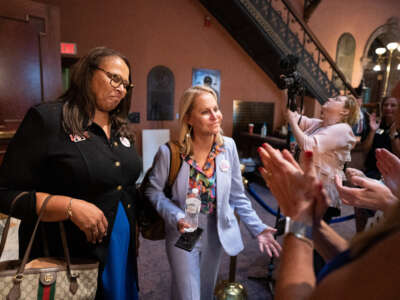 Democratic state Sen. Margie Bright Matthews (L) and Republican state Sen. Sandy Senn react to supporters after the Senate passed a ban on abortion after six weeks of pregnancy at the South Carolina Statehouse on May 23, 2023, in Columbia, South Carolina. A bi-partisan group of five women led a filibuster that failed to block the legislation.