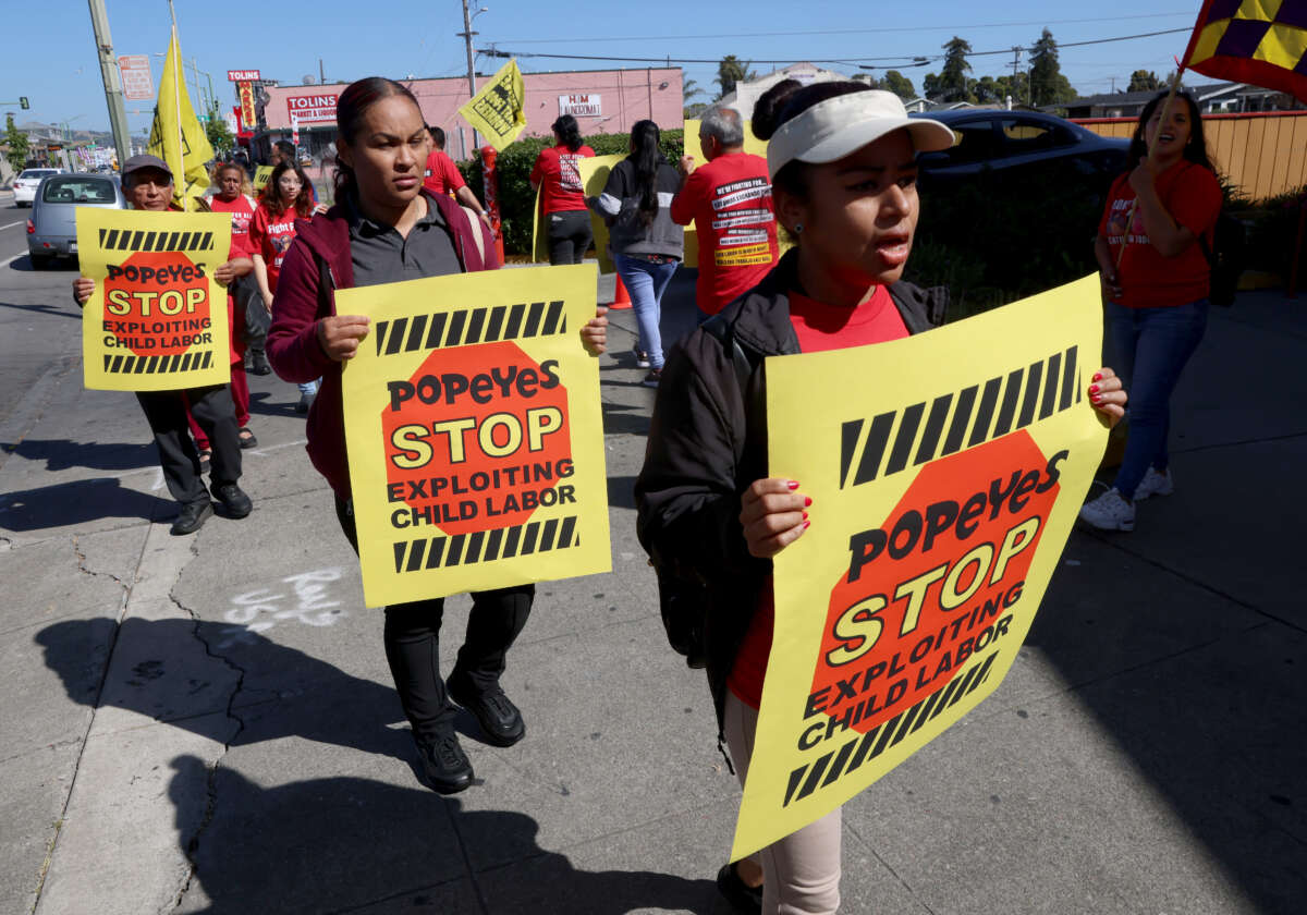 Fast food workers protest at the closed Popeyes Louisiana Chicken on International Boulevard in Oakland, California, on May 18, 2023.