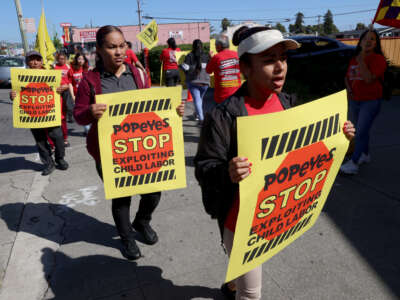 Fast food workers protest at the closed Popeyes Louisiana Chicken on International Boulevard in Oakland, California, on May 18, 2023.