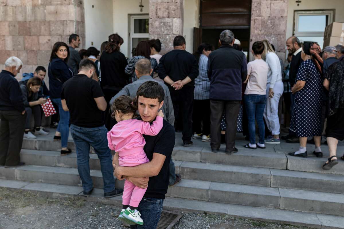 Refugees from Azerbaijan-controlled region of Nagorno-Karabakh wait for humanitarian aid in the village of Hayanist, Armenia, on October 8, 2023.