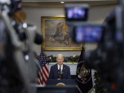 Framed by television cameras, U.S. President Joe Biden delivers a statement urging Congress to pass his national security supplemental request from the Roosevelt Room at the White House, on December 6, 2023, in Washington, D.C.