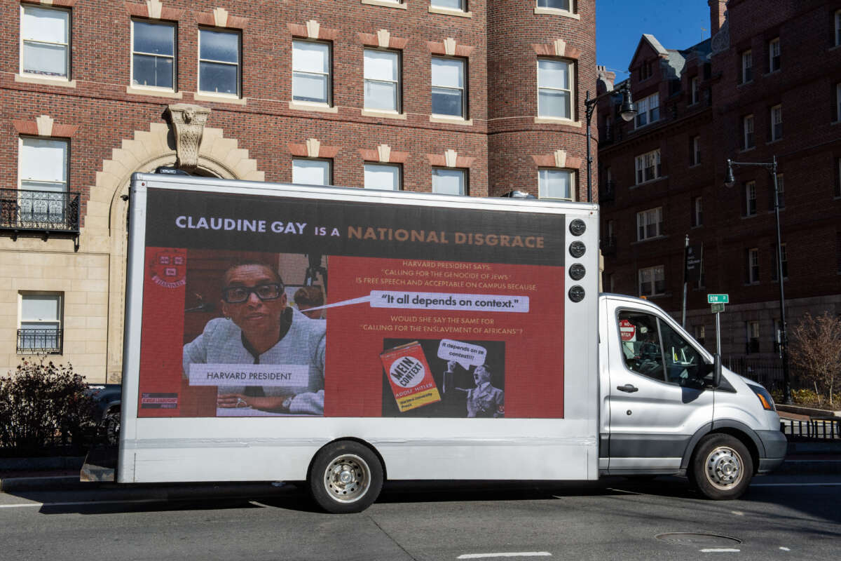 A truck calling the president of Harvard a "national disgrace" drives around Harvard University in Cambridge, Massachusetts, on December 12, 2023.