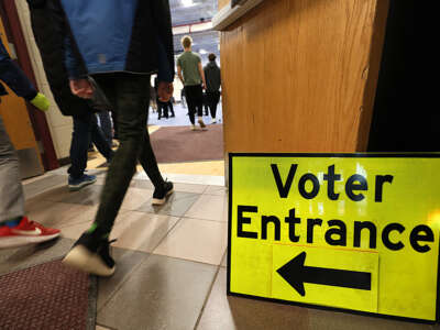 Voters enter the gymnasium at Bedford High School in Bedford, New Hampshire, on January 23, 2024.