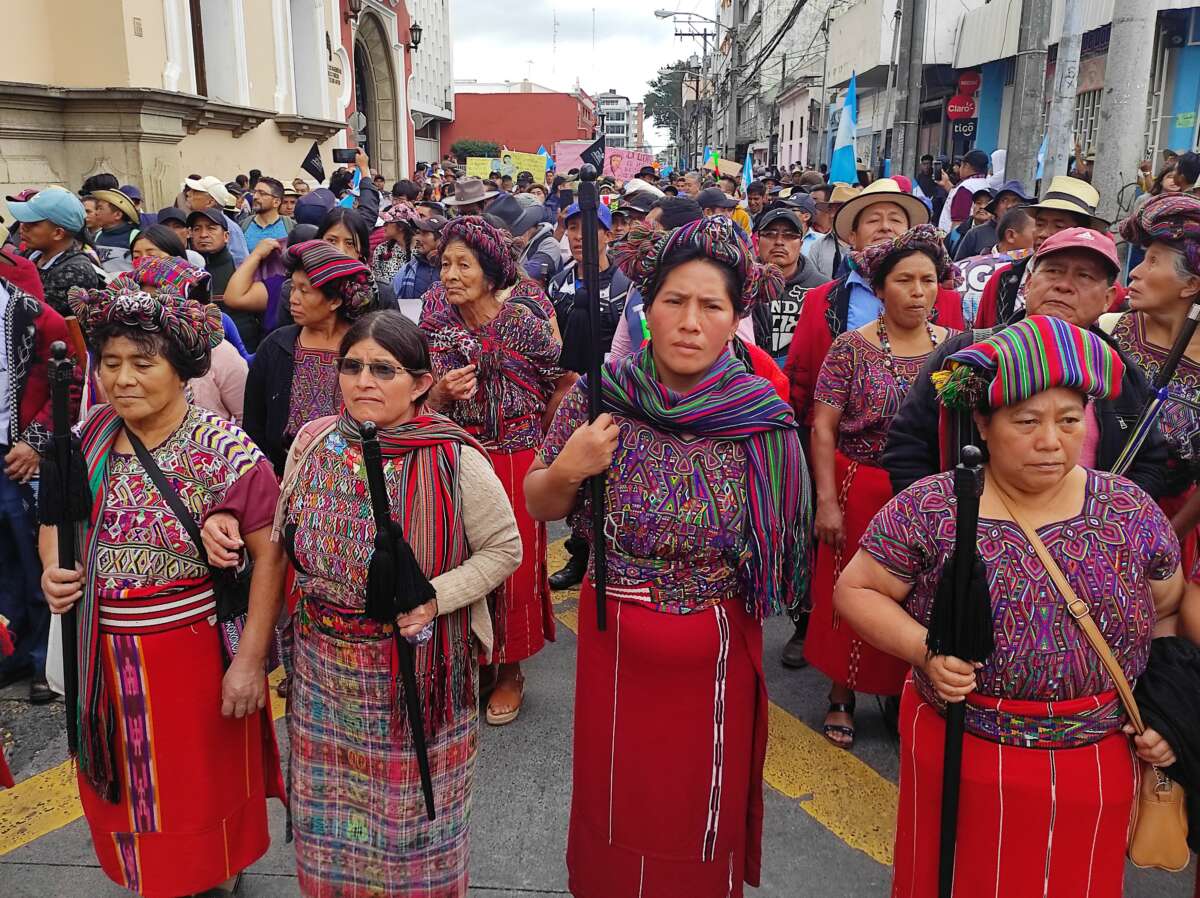 Indigenous Maya Ixil authorities lead thousands of people marching for democracy in Guatemala City.