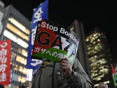 People gather and demonstrate on the street to express their solidarity with Palestinian people as part of the International Day of Solidarity with the Palestinian people in Tokyo, Japan, on November 29, 2023.