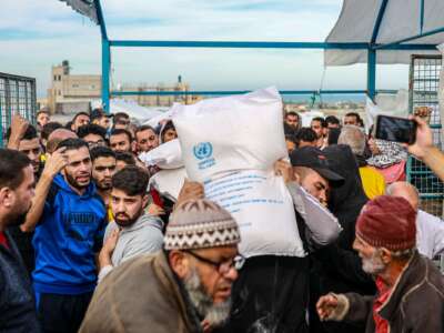 Flour is being distributed in Khan Yunis by the UNRWA to Gazans who had difficulty finding bread due to Israeli attacks, on November 22, 2023 in Gaza.