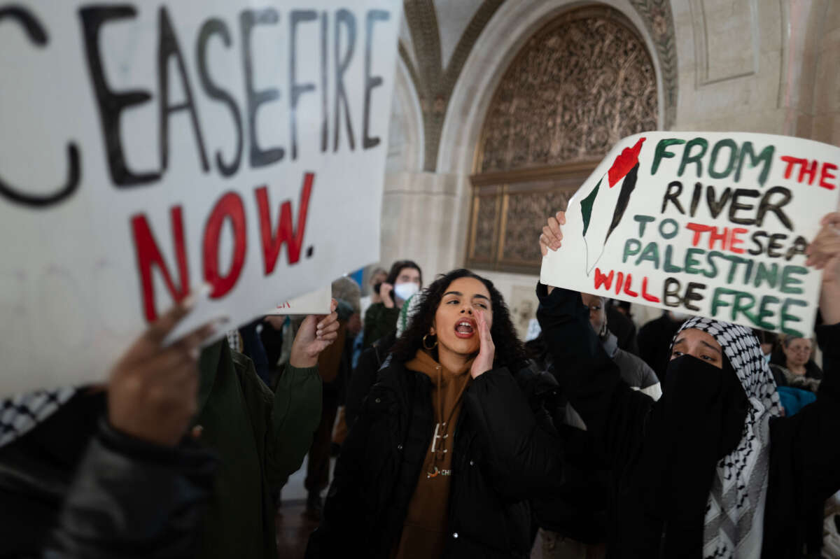 Pro-Palestine demonstrators rally in the lobby of City Hall while the City Council debates a symbolic resolution calling for a ceasefire in the war between Israel and Hamas on January 31, 2024, in Chicago, Illinois.