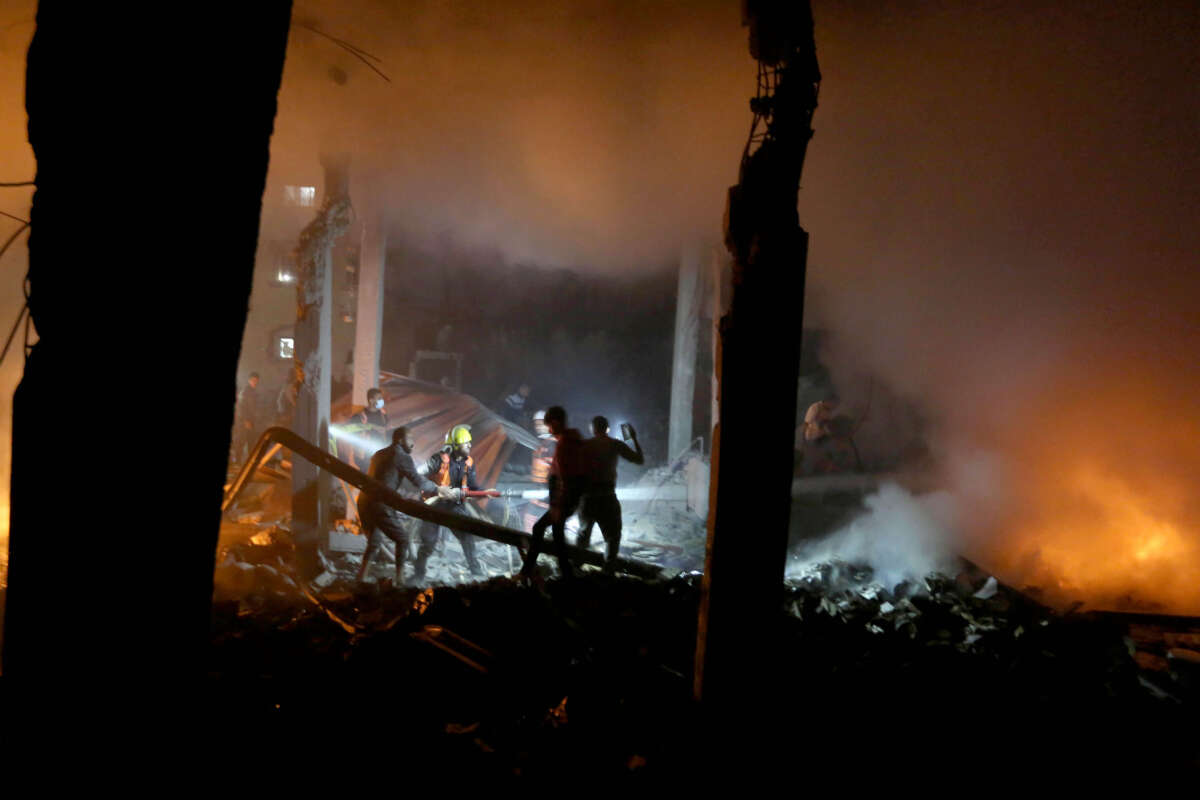 Firefighters intervene after a fire breaks out following an attack on the home of the Al-Tavil family as Israeli attacks continue in Az-Zawayda within the Gaza Strip, on December 27, 2023.