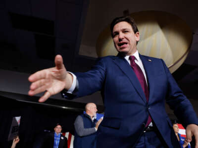 Florida Gov. Ron DeSantis greets supporters at his caucus night event on January 15, 2024, in West Des Moines, Iowa.