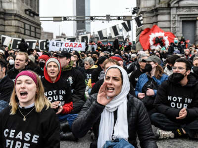 Activists from the group Jewish Voice for Peace stage a sit-in blockade of the Manhattan Bridge on November 26, 2023, in New York City.