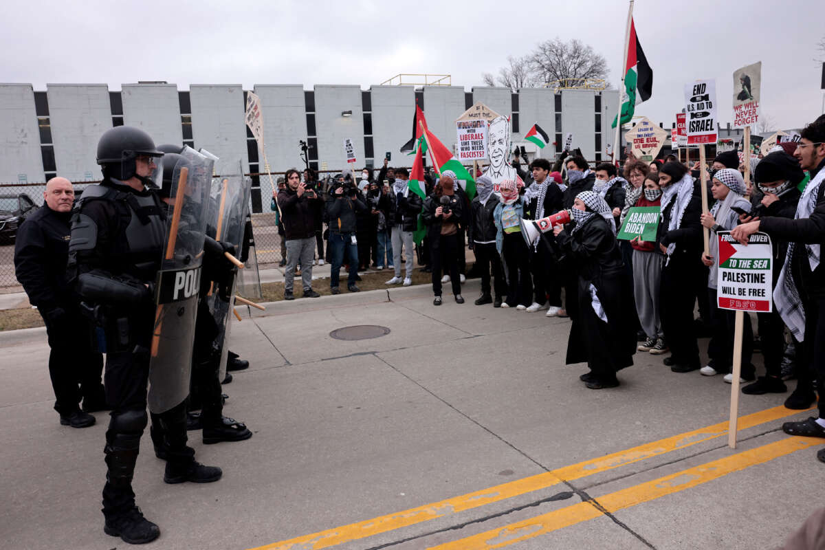 People gather in support of Palestinians outside of the venue where President Joe Biden is speaking to members of the United Auto Workers (UAW) at the UAW National Training Center, in Warren, Michigan, on February 1, 2024.