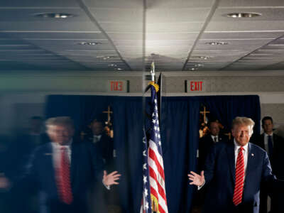 Former President Donald Trump arrives for a campaign rally in the basement ballroom of The Margate Resort on January 22, 2024, in Laconia, New Hampshire.