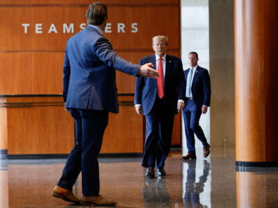 Former President Donald Trump walks to a podium to deliver remarks after meeting with leaders of the International Brotherhood of Teamsters at their headquarters on January 31, 2024, in Washington, D.C.