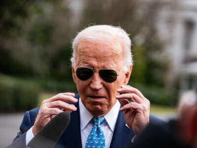 President Joe Biden departs the White House and stops to talk to the press on his way to an event in Miami, Florida, on January 30, 2024.