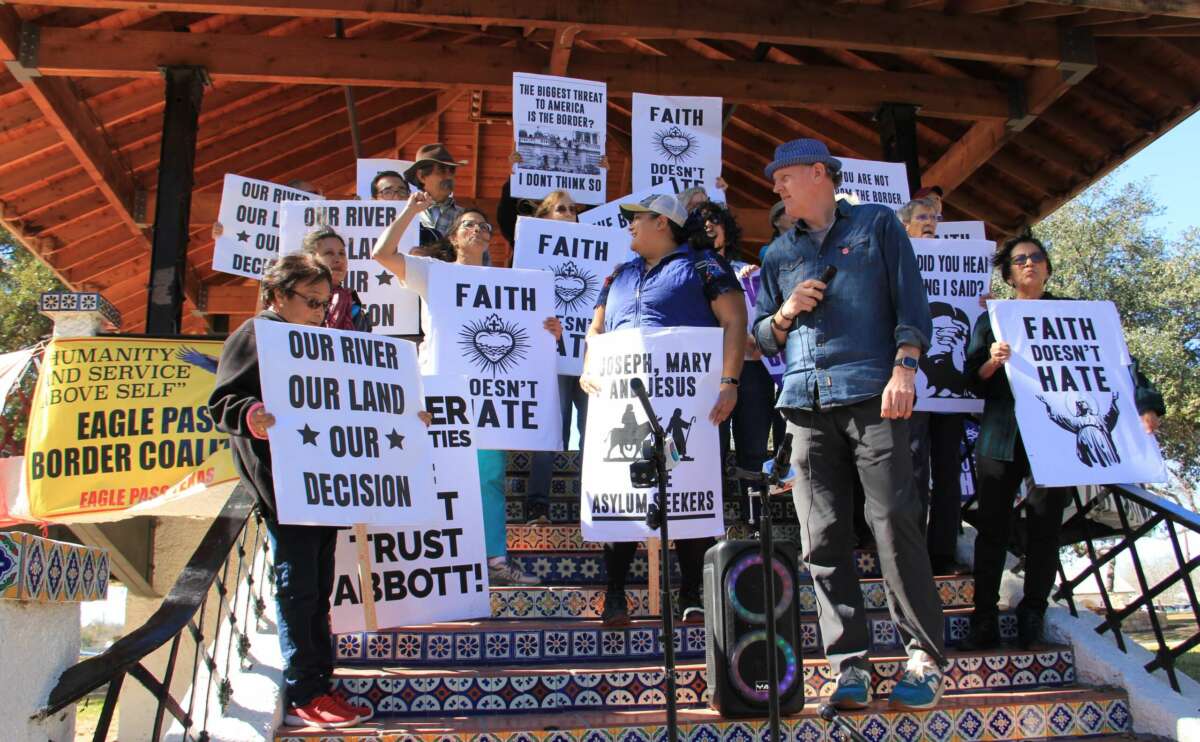 Eagle Pass residents with the newly formed Eagle Pass Border Coalition join with organizers from the No Border Wall Laredo Coalition in San Juan Park just before Texas Gov. Greg Abbott's news conference in Shelby Park on February 4 in Eagle Pass, Texas.