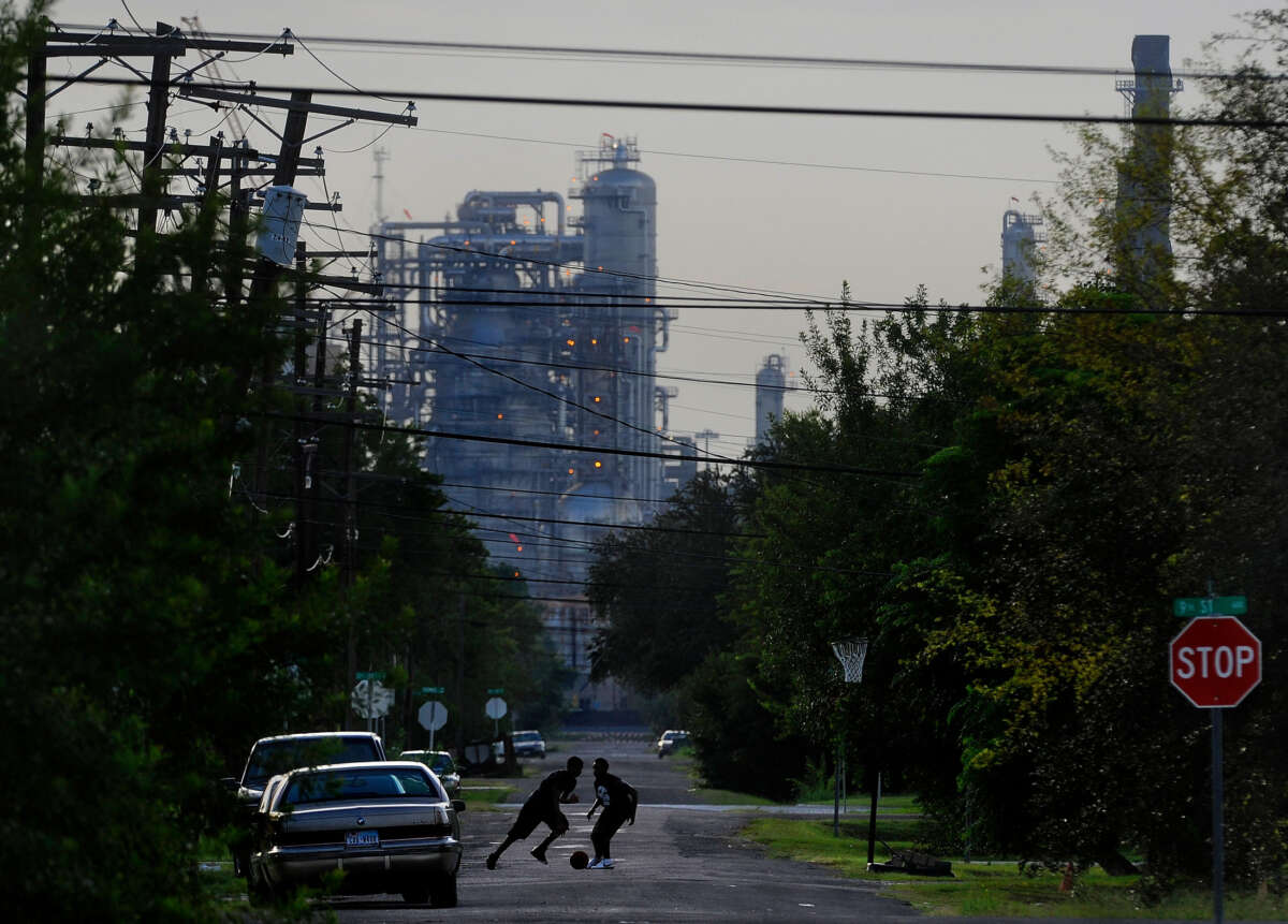 Oil facilities are seen past neighborhoods in Port Arthur, Texas, on September 12, 2012.