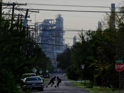 Oil facilities are seen past neighborhoods in Port Arthur, Texas, on September 12, 2012.