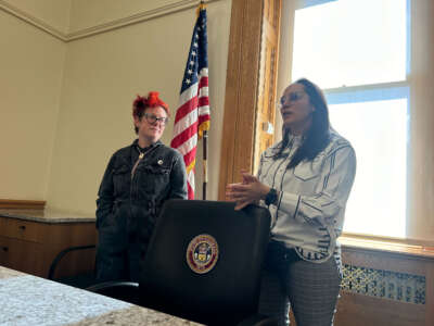 Z Williams, Director of Client Support and Operations at the Denver-based nonprofit Bread and Roses Legal Center, stands to the left of Rep. Lorena García (D), the sponsor for Tiara’s Law.