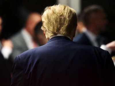 Former President Donald Trump departs a pre-trial hearing in a hush-money case at Manhattan Criminal Court on February 15, 2024, in New York City.